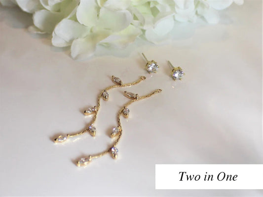 Gold filled earrings with multiple crystal cubic zirconias are displayed on a white reflective surface and showcasing how they can be worn two ways.