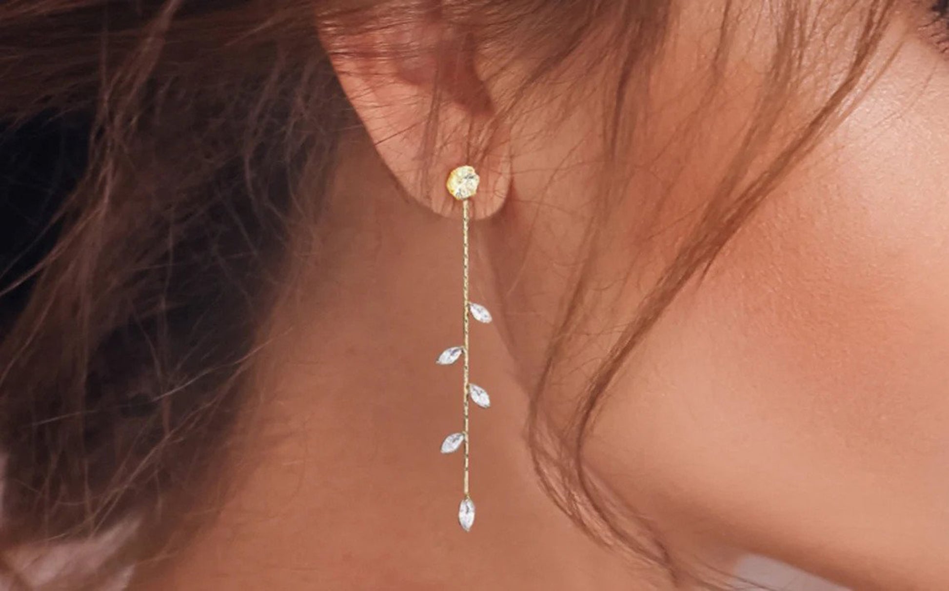 14k gold filled wedding earrings with crystals and a large diamond stud are shown on a models ear.