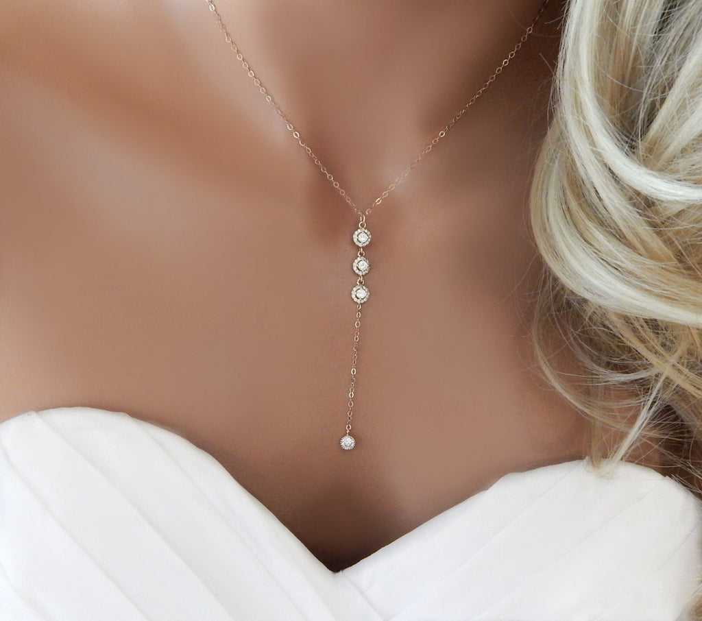 Bridal mannequin torso wearing a rose gold lariat Y necklace with cubic zirconia diamonds.