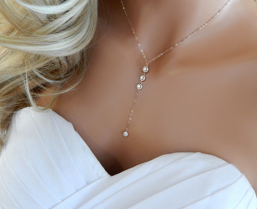 Blonde bridal mannequin torso wearing a 14k gold lariat Y necklace with cubic zirconia diamonds.