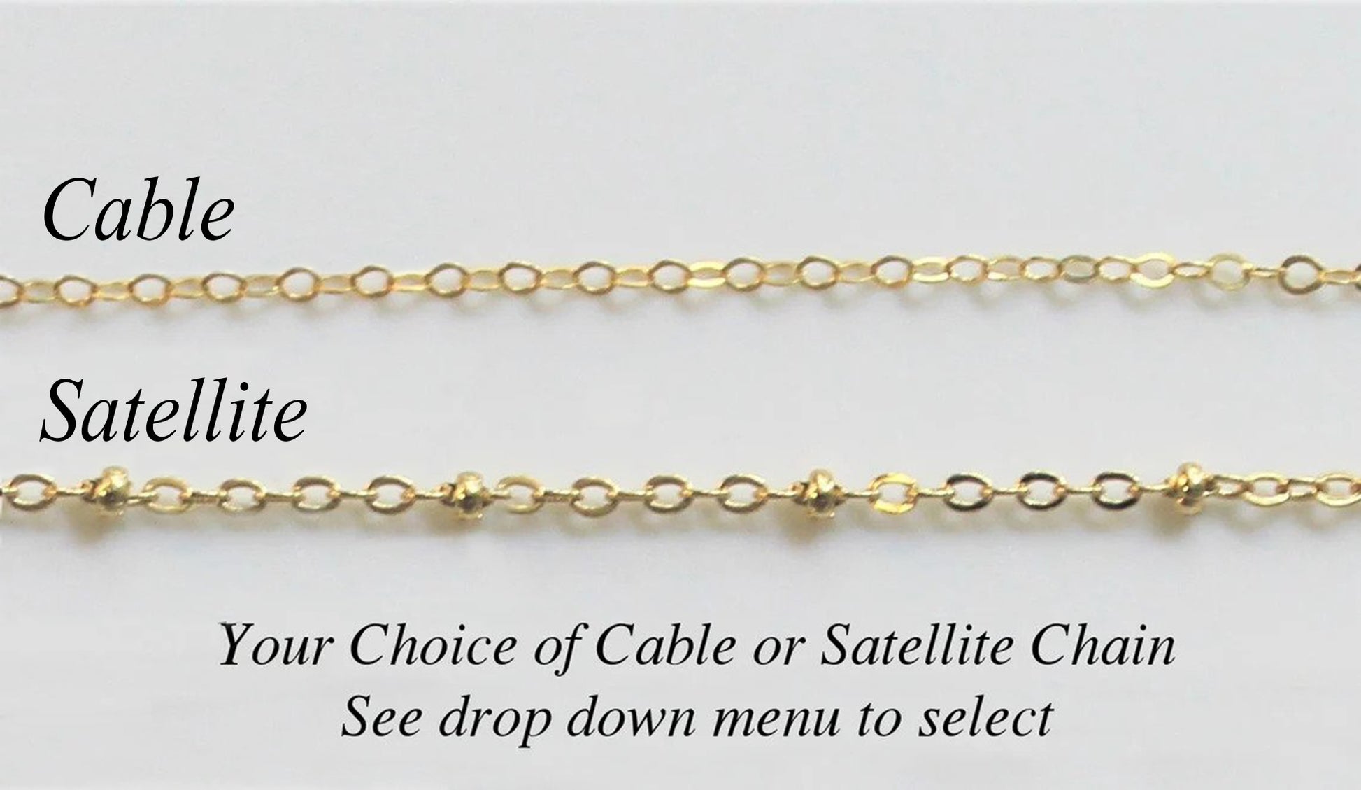 Two different gold filled necklace chain options available by custom jewerly store Gilded Sapphire with cable chain and satellite chain laying on a plain gray surface.