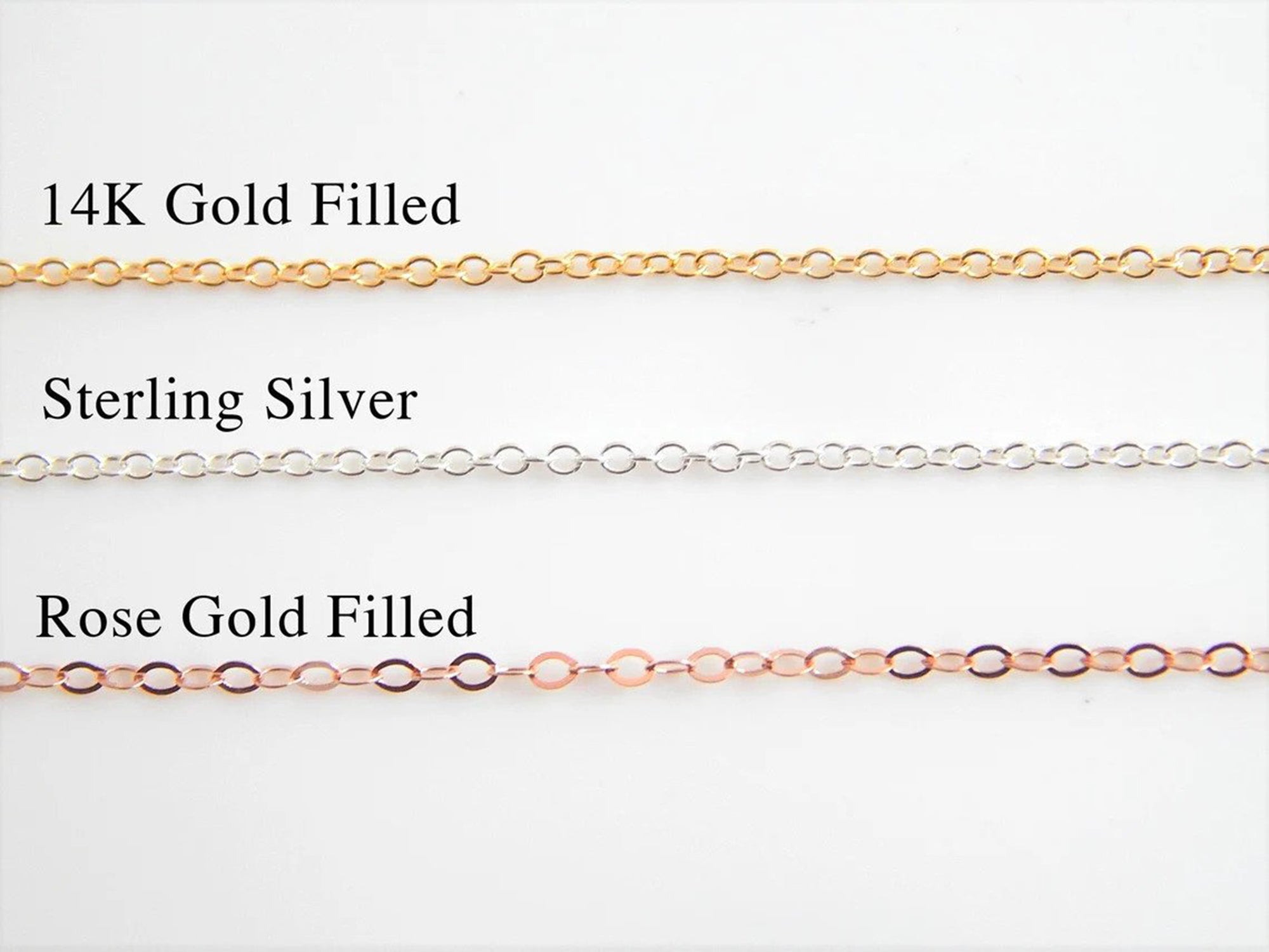 Three metal finishes offered by Gilded Sapphire's custom and handmade jewelry including 14 carat gold filled, sterling silver, and rose gold filled chain.